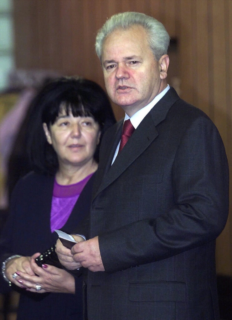Mirjana Markovic, the leader of JUL-Yugoslav Leftist Union, and her husband and partner in ruling coalition, Yugoslav president Slobodan Milosevic, wait to vote, Sunday, Sept. 24, 2000 at polling station in Belgrade. Abandoned by his closest allies and living under virtual house arrest, Milosevic and his wife, a once formidable politician in her own right, are sitting out Yugoslavia's pro-democracy tidal wave in a government villa, the officials said, Tuesday, Oct. 10, 2000. (AP Photo/Srdjan Ilic)