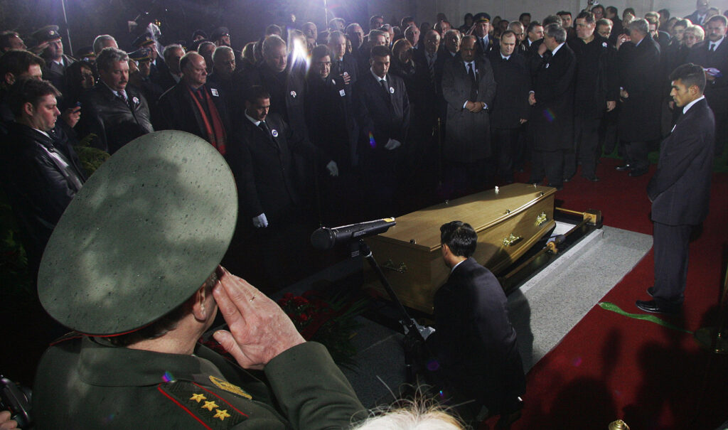 Russian General leonyd Ivashov salutes during funeral of former Serbian leader Slobodan Milosevic's in his native town of Pozarevac, some 50 kilometers (30 miles southeast of Belgrade, Saturday, March 18, 2006. Milosevic died on March 11 in his prison cell in The Hague and was buried in yard of his house, in his borntown of Pozarevac. (AP Photo/Srdjan Ilic, Pool)